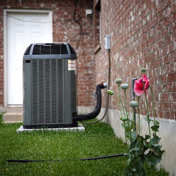 High efficiency modern AC-heater unit on house backyard