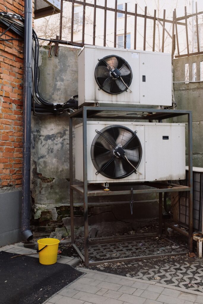 two heat pumps installed near the building