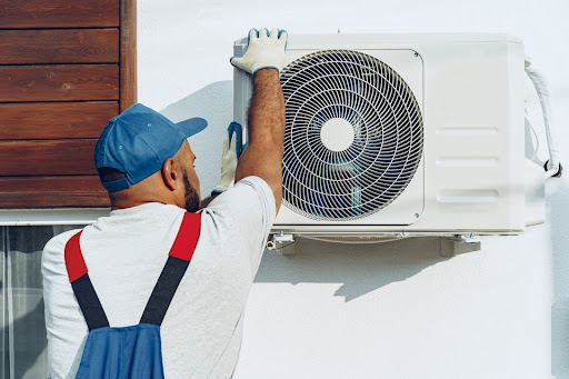 a man putting on air conditioning