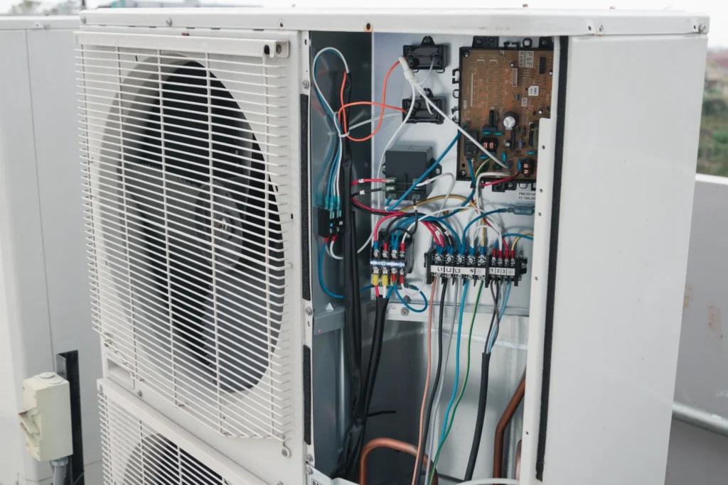 Exposed wiring and electrical issues can lead to faulty air conditioning compressors